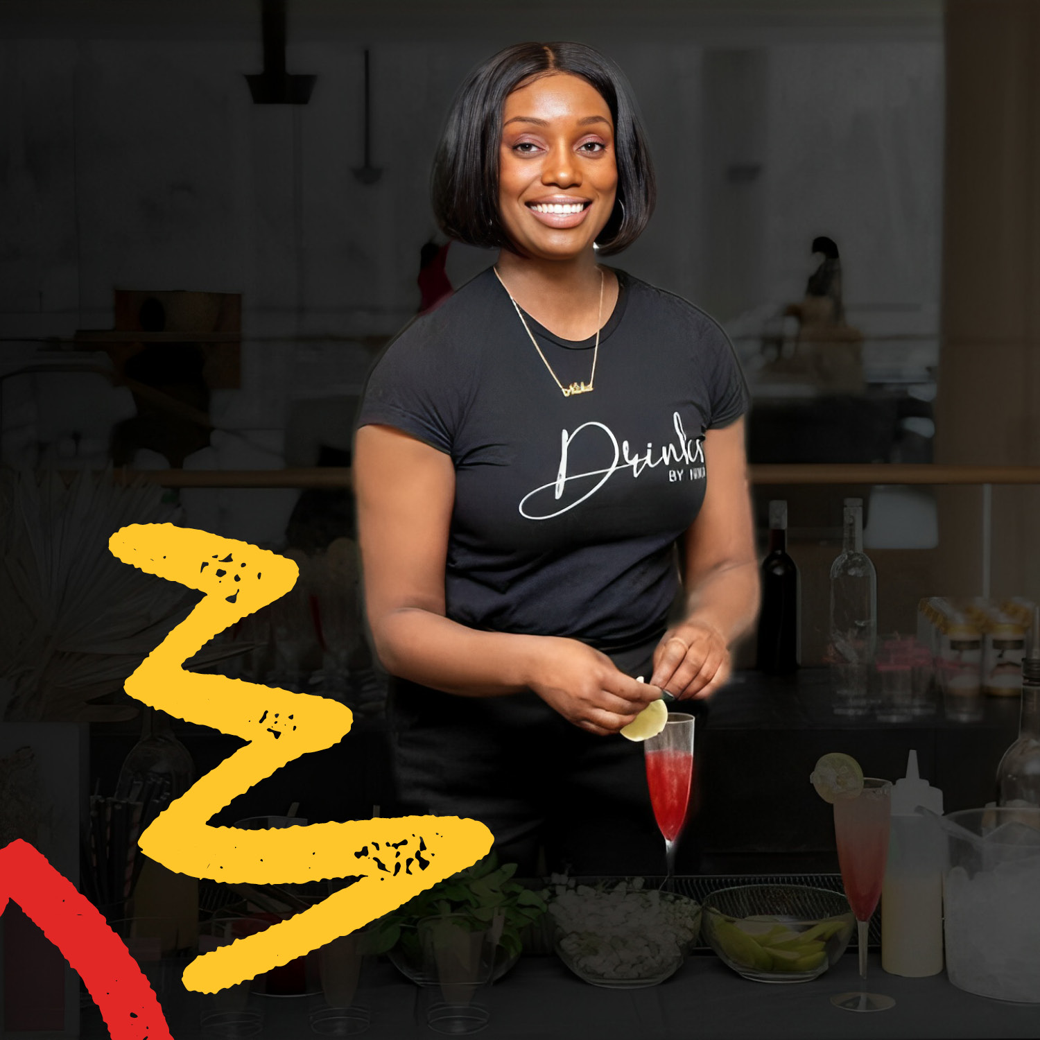 Tenika Bennett preparing a drink, wearing a "Drinks by Nika" shirt.